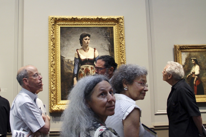 Visitors look at Jean-Baptiste-Camille Corot's "Agostina" (1866) at the National Gallery of Art in Washington on September 5, 2018 Photo by Olivia HAMPTON